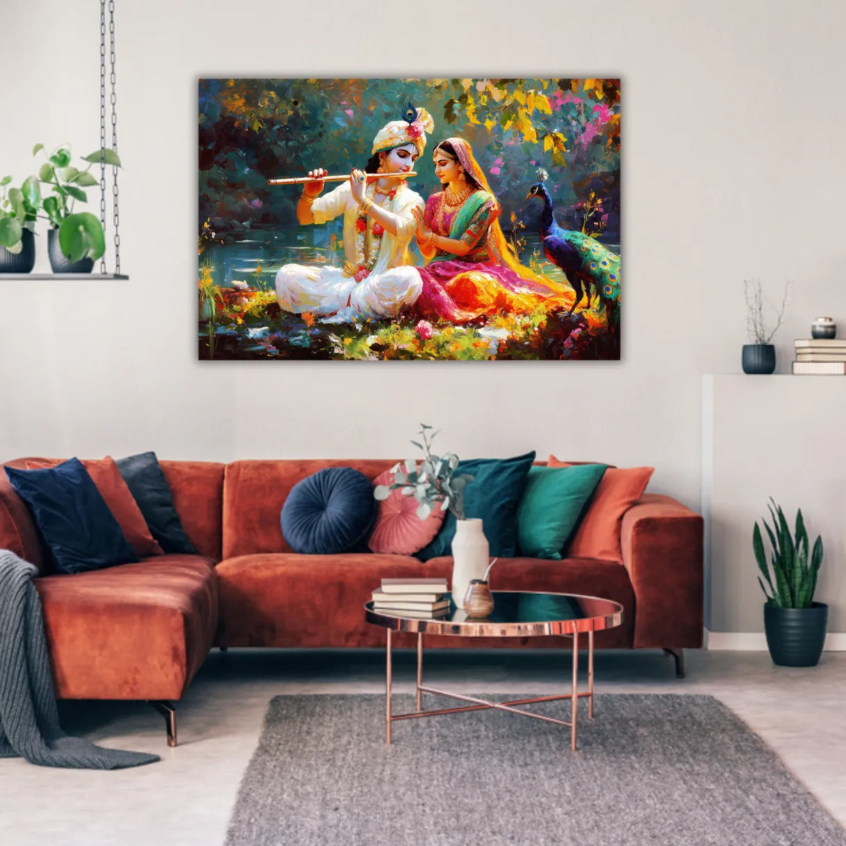 Living room with a large painting of Radha Krishna on the wall above a red sofa.