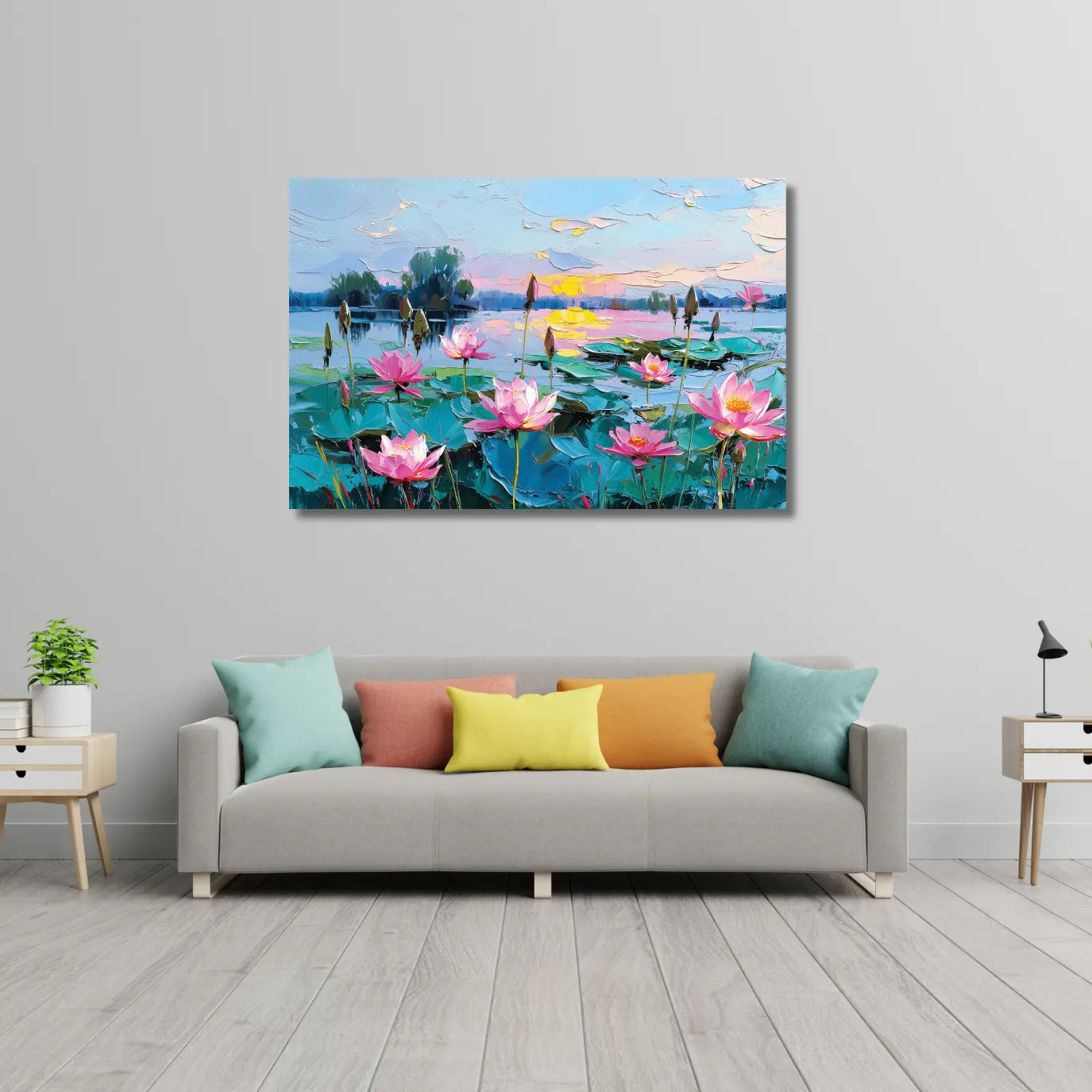 Colorful painting of a lake with pink lotus flowers on a gray wall above a sofa.