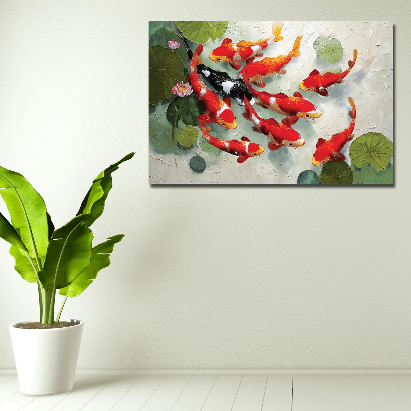 Canvas print of colorful koi fish and lotus flowers on a wall above a potted plant.
