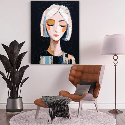 Modern living room with a painting of a woman's face on the wall, brown chair, and decorative items.