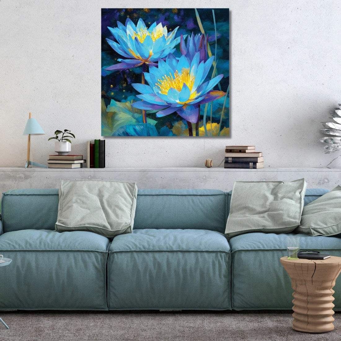 Colorful painting of blue lotus flowers above a blue sofa in a living room.