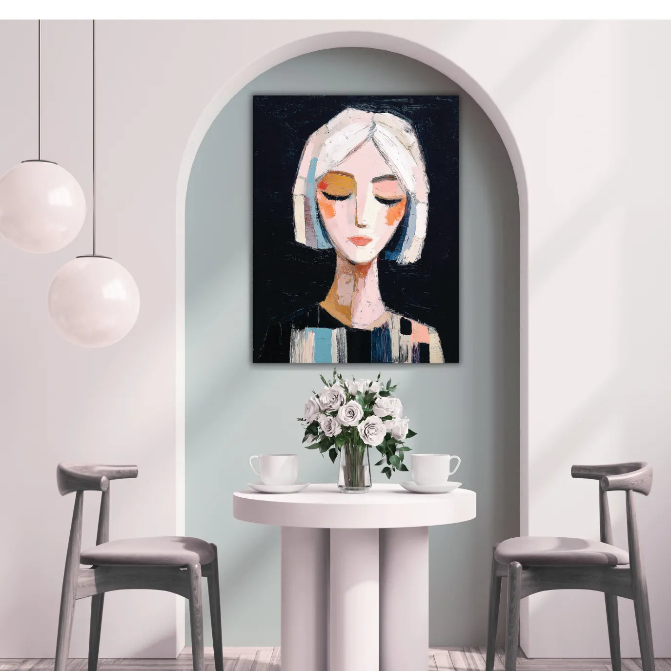 Modern interior with a painting of a woman's face on the wall / girl painting above a small table with flowers and cups.