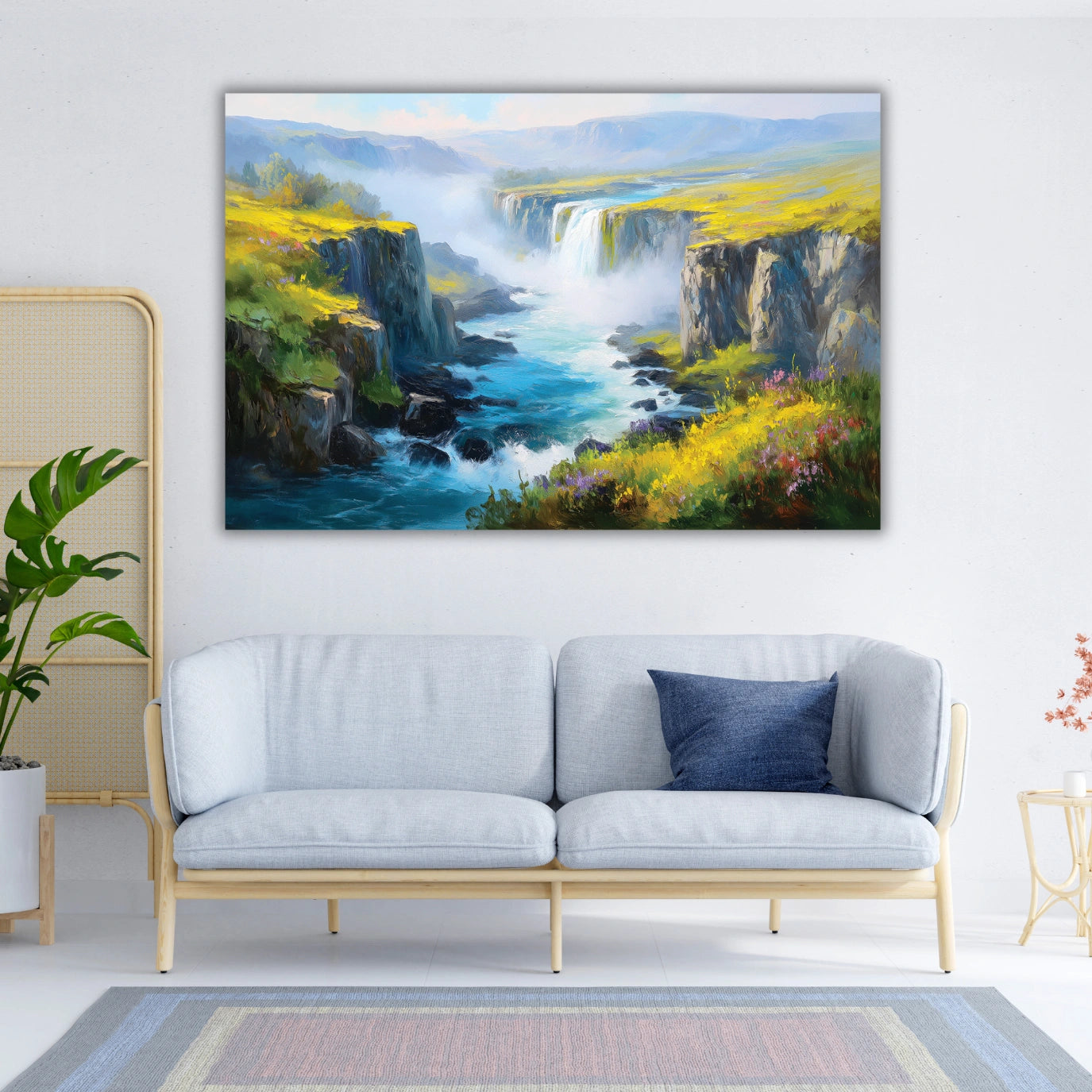 Landscape painting of a waterfall above a sofa in a living room